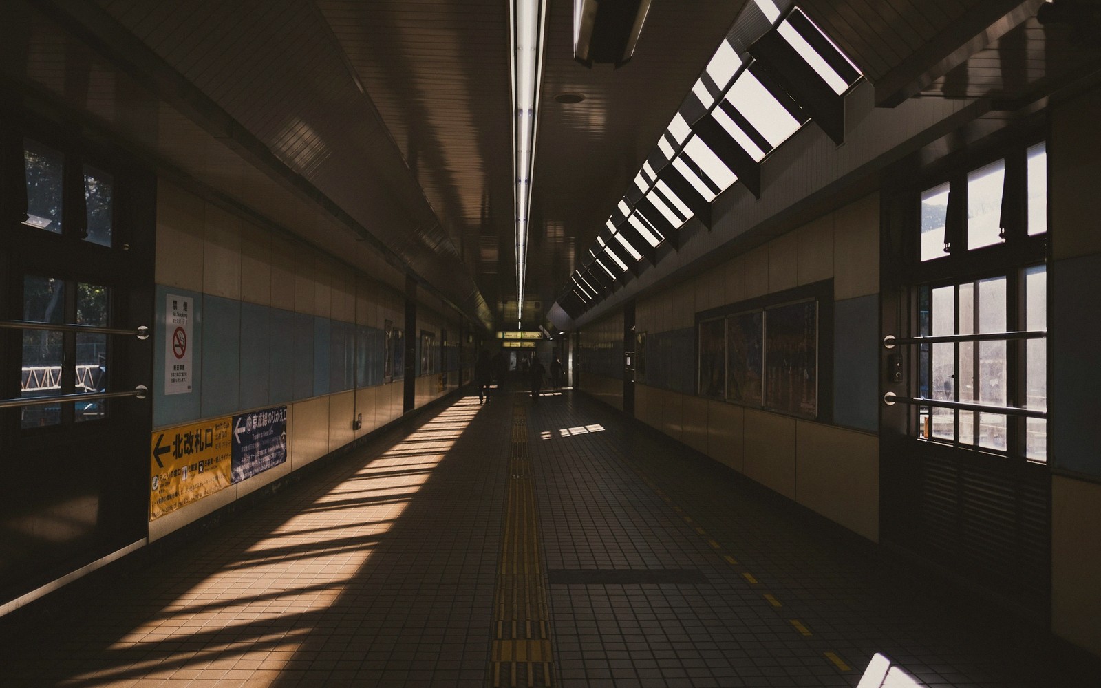 an overnight train corridor at night, empty, warm light